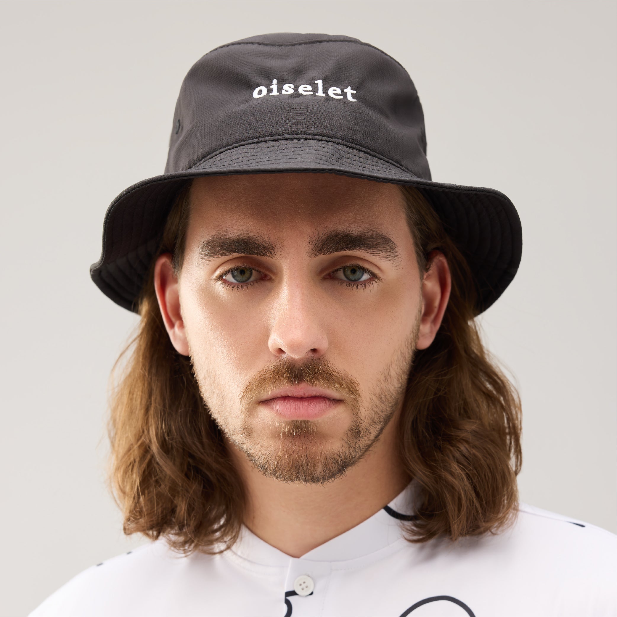 Lecolet Golf bucket hat in black with the word oiselet embroidered on the front