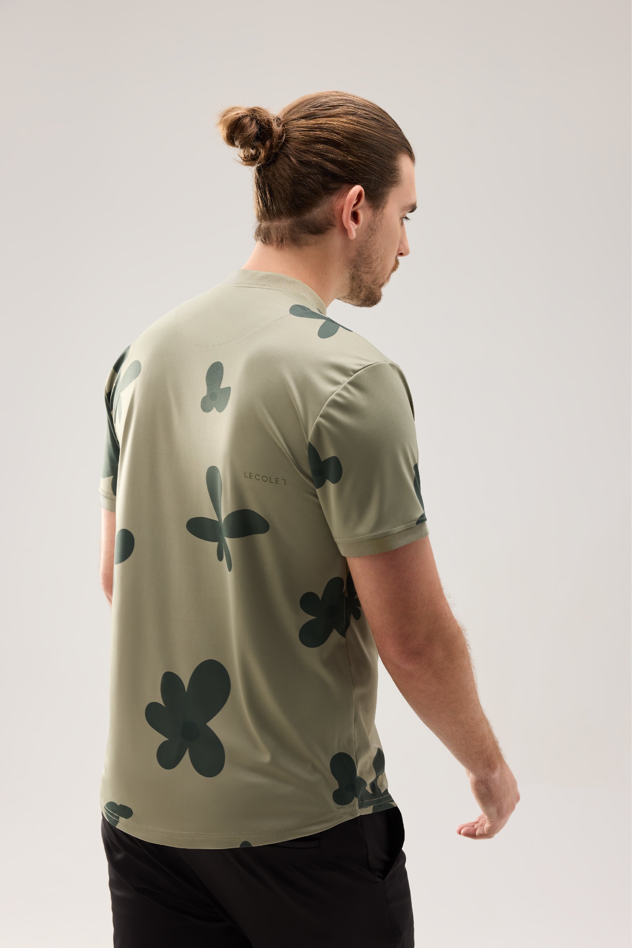 Lecolet SEED golf polo Green blossom. Green golf polo with darker flower design.