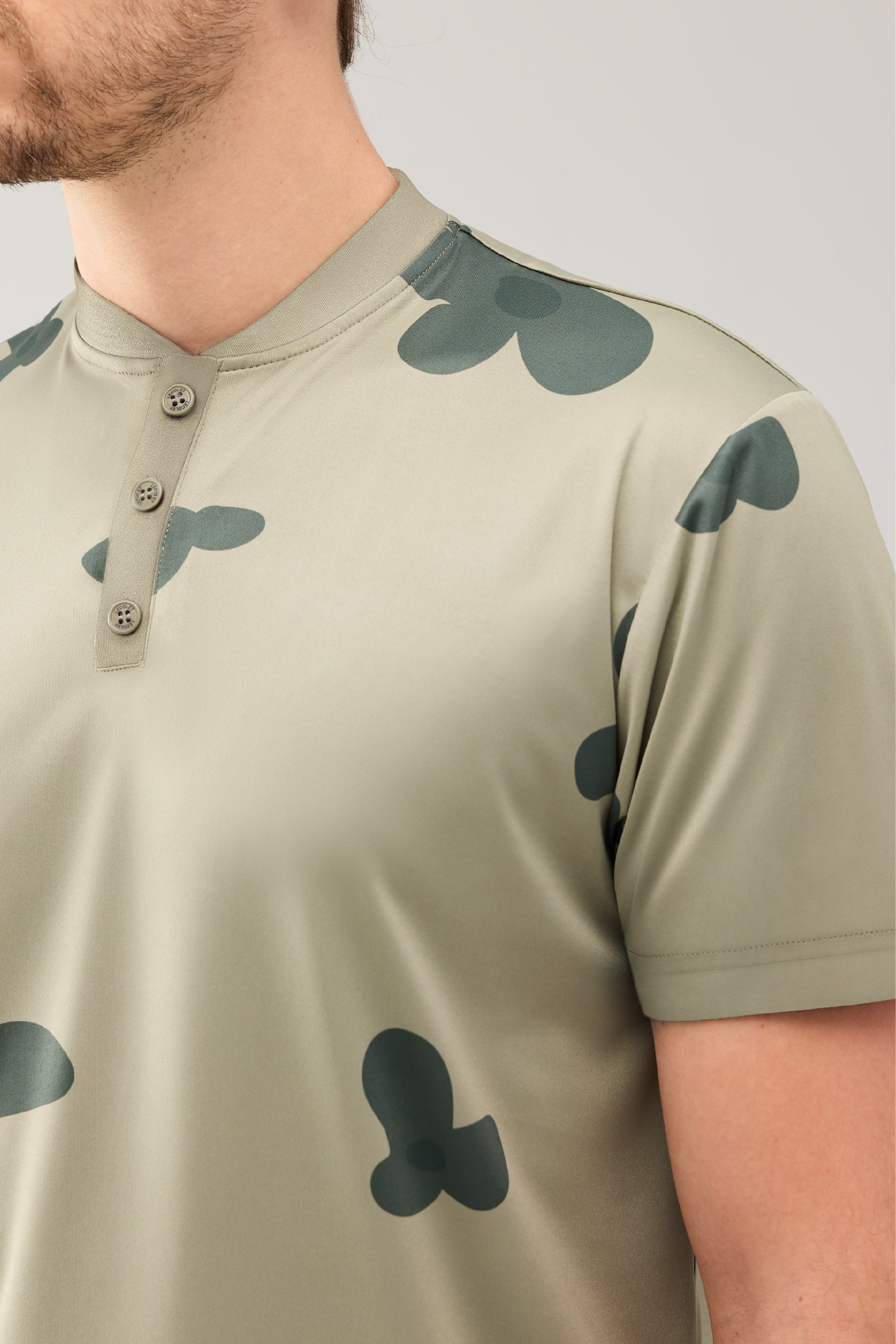 Lecolet SEED golf polo Green blossom. Green golf polo with darker flower design.