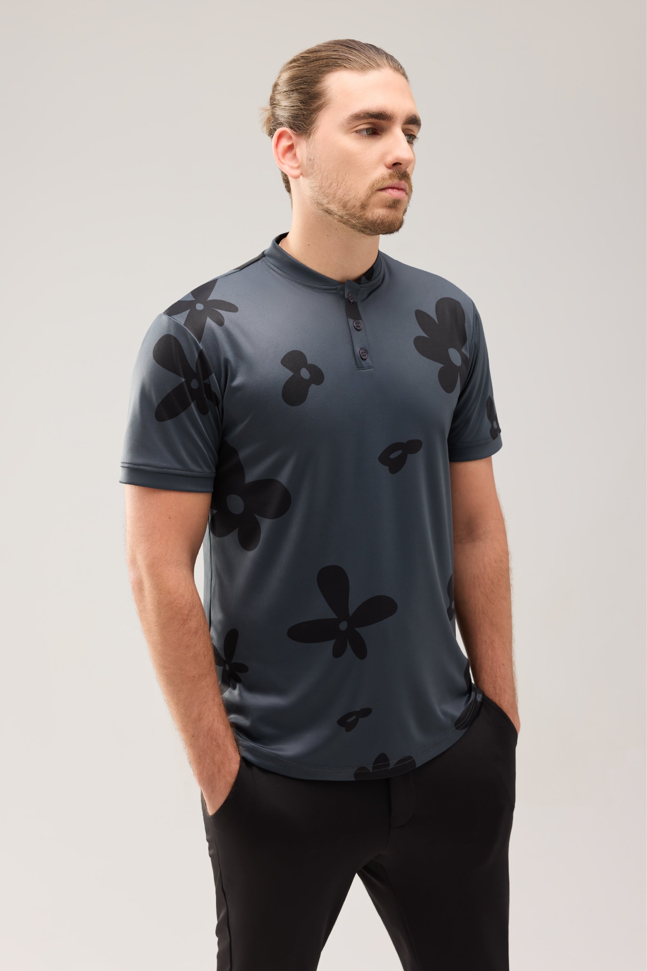 Lecolet SEED golf polo Night Bloom. Dark grey golf polo with darker flower design.